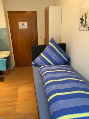 Ein Bett oder Betten in einem Zimmer der Unterkunft Gästehaus Ziemons
