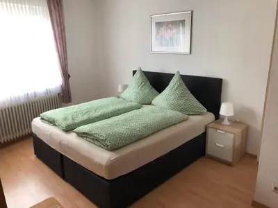 Ein Bett oder Betten in einem Zimmer der Unterkunft Gästehaus Ziemons
