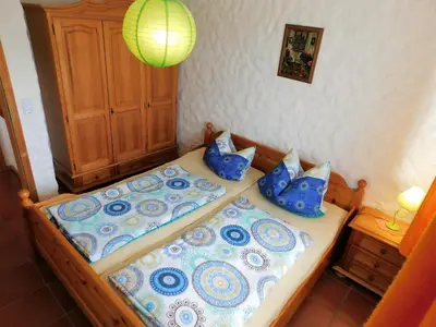 Ein Bett oder Betten in einem Zimmer der Unterkunft Blockhaus-Ferienpark