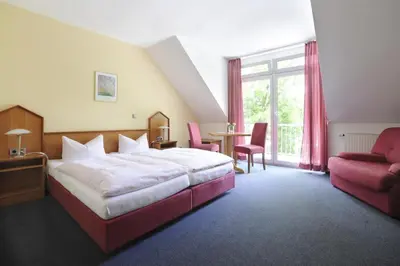 Ein Bett oder Betten in einem Zimmer der Unterkunft Hotel zur Post