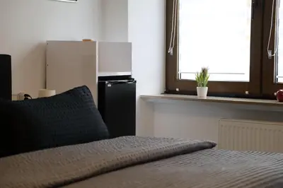 Ein Bett oder Betten in einem Zimmer der Unterkunft Pension am Treiser Kiosk