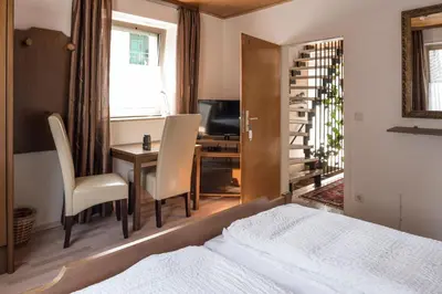 Ein Bett oder Betten in einem Zimmer der Unterkunft Gästezimmer Strauß
