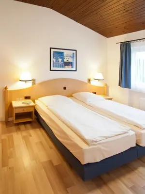 Ein Bett oder Betten in einem Zimmer der Unterkunft Eifelblick über dem See