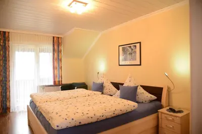 Ein Bett oder Betten in einem Zimmer der Unterkunft Ferienwohnung Haus Kotthoff