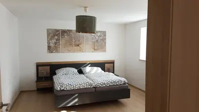 Ein Bett oder Betten in einem Zimmer der Unterkunft Ferienwohnung Adams