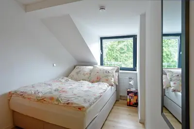 Ein Bett oder Betten in einem Zimmer der Unterkunft FeWo Kröger