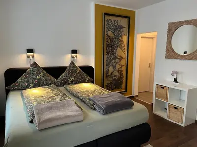 Ein Bett oder Betten in einem Zimmer der Unterkunft Ferienwohnung1 Daun