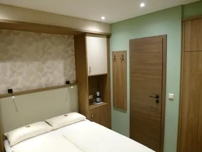 Ein Bett oder Betten in einem Zimmer der Unterkunft Landhaus Müller
