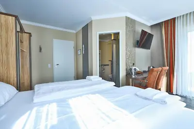 Ein Bett oder Betten in einem Zimmer der Unterkunft M13 Hotel