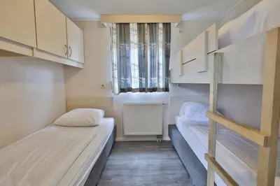 Ein Bett oder Betten in einem Zimmer der Unterkunft M13 Hotel
