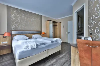 Ein Bett oder Betten in einem Zimmer der Unterkunft M13 Hotel