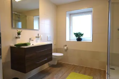 Ein Badezimmer in der Unterkunft Pitlane Apartments am Brünnchen