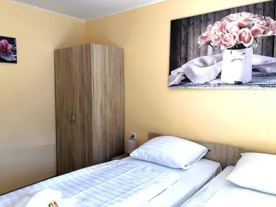 Ein Bett oder Betten in einem Zimmer der Unterkunft MaximilianHaus