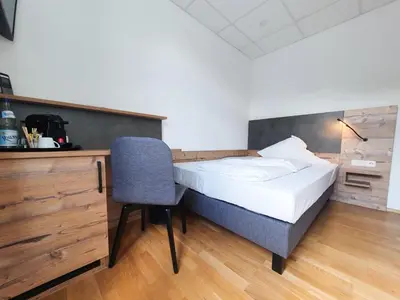 Ein Bett oder Betten in einem Zimmer der Unterkunft Winzerhaus Gärtner - An der Loreley