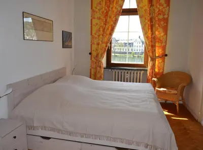 Ein Bett oder Betten in einem Zimmer der Unterkunft Ferienwohnungen am Stadtpalais - Bernkastel