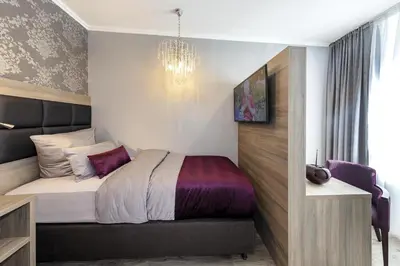 Ein Bett oder Betten in einem Zimmer der Unterkunft Apartmenthaus Burgenheimat in Rhens bei Koblenz