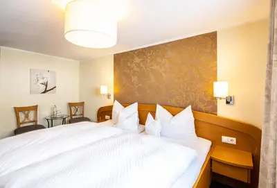 Ein Bett oder Betten in einem Zimmer der Unterkunft Gasthaus Assenmacher