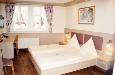 Ein Bett oder Betten in einem Zimmer der Unterkunft Hotel Gute Quelle