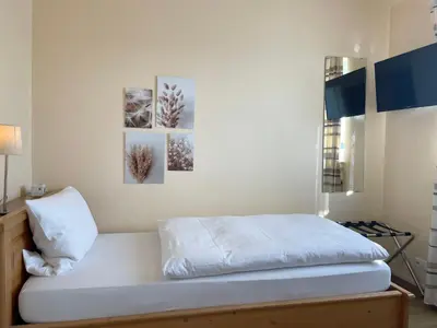 Ein Bett oder Betten in einem Zimmer der Unterkunft Hotel-Pension Hommen