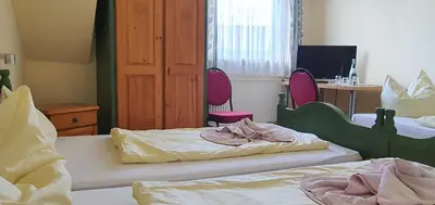 Ein Bett oder Betten in einem Zimmer der Unterkunft Hotel & Restaurant Beckmanns Winzerhaus