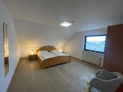 Ein Bett oder Betten in einem Zimmer der Unterkunft Ferienwohnung Adelheid Brachtendorf