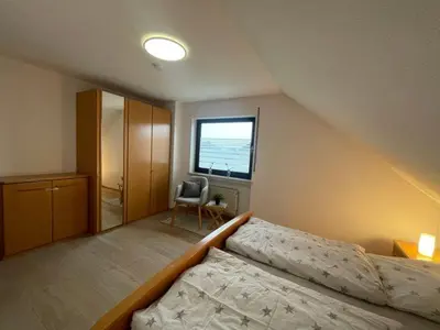 Ein Bett oder Betten in einem Zimmer der Unterkunft Ferienwohnung Adelheid Brachtendorf