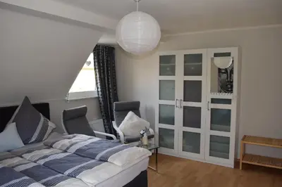 Ein Bett oder Betten in einem Zimmer der Unterkunft Gästehaus Voyage