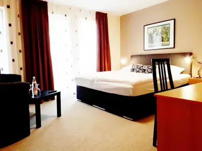Ein Bett oder Betten in einem Zimmer der Unterkunft Hotel Restaurant Denis
