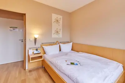 Ein Bett oder Betten in einem Zimmer der Unterkunft Moselhaus Weiskopf `SelfCheckIn`OffSiteBreakfast`CityParking`