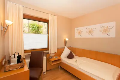 Ein Bett oder Betten in einem Zimmer der Unterkunft Moselhaus Weiskopf `SelfCheckIn`OffSiteBreakfast`CityParking`
