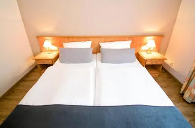 Ein Bett oder Betten in einem Zimmer der Unterkunft Landhotel Ringelsteiner Mühle