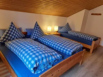 Ein Bett oder Betten in einem Zimmer der Unterkunft Ferienwohnung Martin