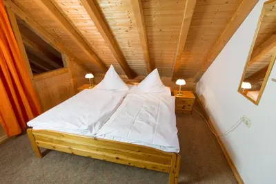 Ein Bett oder Betten in einem Zimmer der Unterkunft Weingut & Gästehaus Heidhof