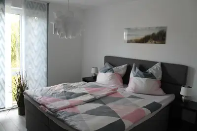 Ein Bett oder Betten in einem Zimmer der Unterkunft Ferienwohnung Ida