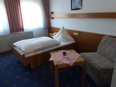 Ein Bett oder Betten in einem Zimmer der Unterkunft Bengel's Hotel zur Krone