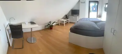 Ein Bett oder Betten in einem Zimmer der Unterkunft Ferien Apartment Trier Süd