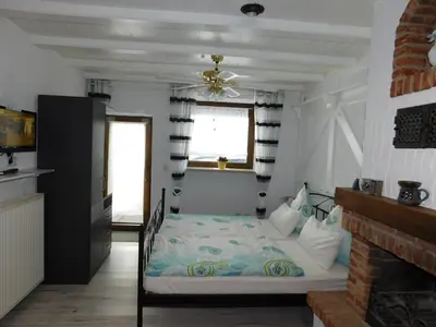 Ein Bett oder Betten in einem Zimmer der Unterkunft Kaminstübchen