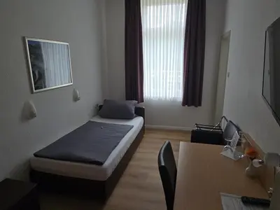 Ein Bett oder Betten in einem Zimmer der Unterkunft Hotel zum Anker