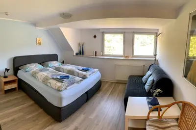 Ein Bett oder Betten in einem Zimmer der Unterkunft Gästehaus Mona Lisa