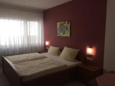 Ein Bett oder Betten in einem Zimmer der Unterkunft Moselhotel Lesura