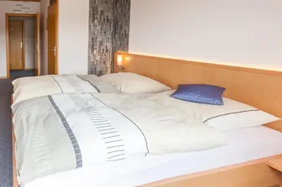 Ein Bett oder Betten in einem Zimmer der Unterkunft Gasthaus am Brunnen