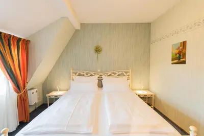 Ein Bett oder Betten in einem Zimmer der Unterkunft Hotel Weiler