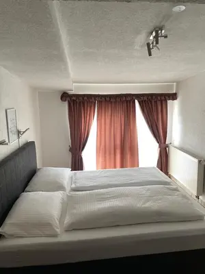 Ein Bett oder Betten in einem Zimmer der Unterkunft Hotel Restaurant Germania