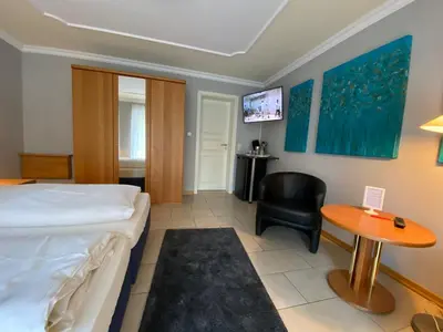 Ein Bett oder Betten in einem Zimmer der Unterkunft Gaestehaus Savo