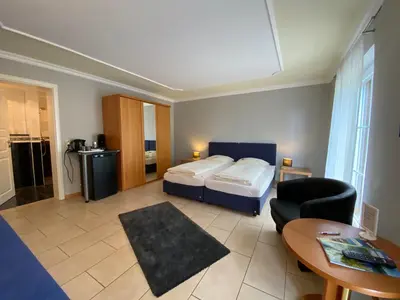 Ein Bett oder Betten in einem Zimmer der Unterkunft Gaestehaus Savo
