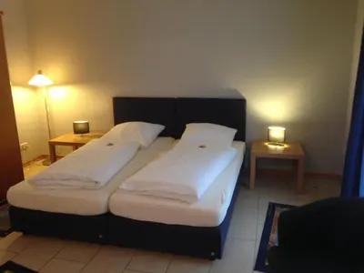Ein Bett oder Betten in einem Zimmer der Unterkunft Gaestehaus Savo