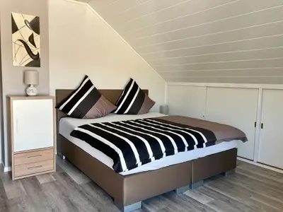 Ein Bett oder Betten in einem Zimmer der Unterkunft Kalverkamp Ferienwohnung