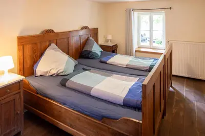 Ein Bett oder Betten in einem Zimmer der Unterkunft Ferienhaus Königskerze
