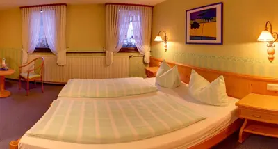 Ein Bett oder Betten in einem Zimmer der Unterkunft Landgasthof Schuck