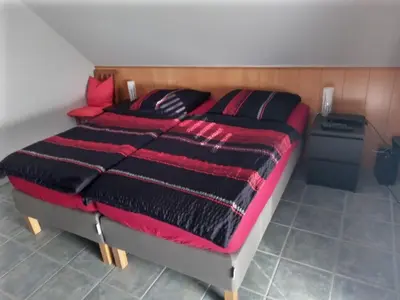 Ein Bett oder Betten in einem Zimmer der Unterkunft Ferienwohnung Bell im Brohltal